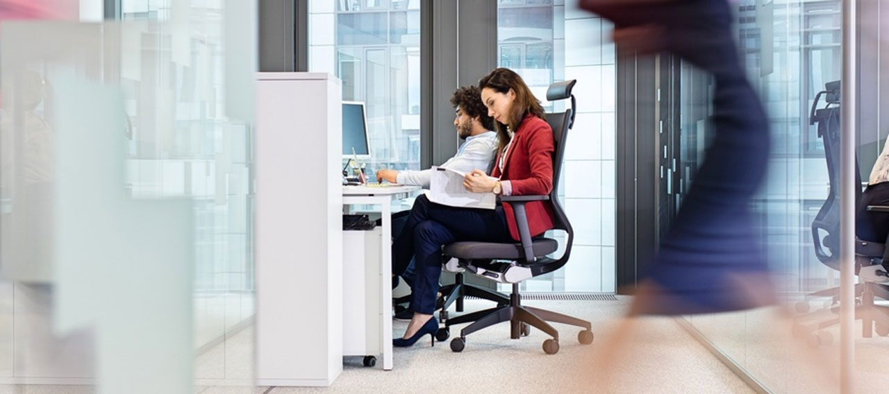 blurred businesswoman walking in the office