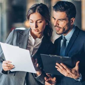 business people looking at documents