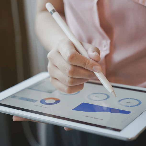 tablet with graphs and stylus being used