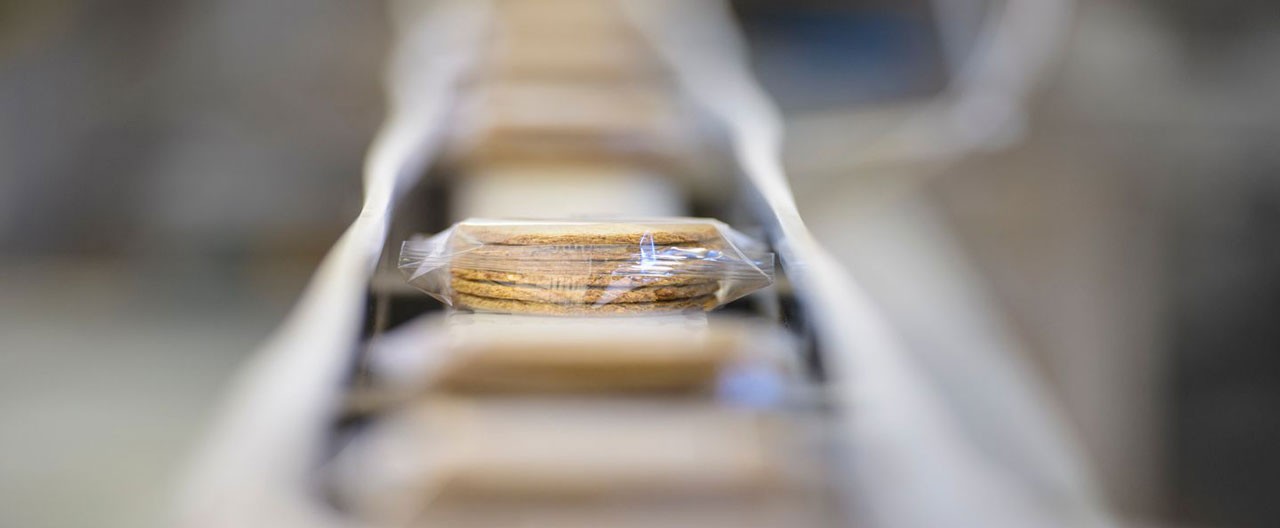 package of biscuits on assembly line