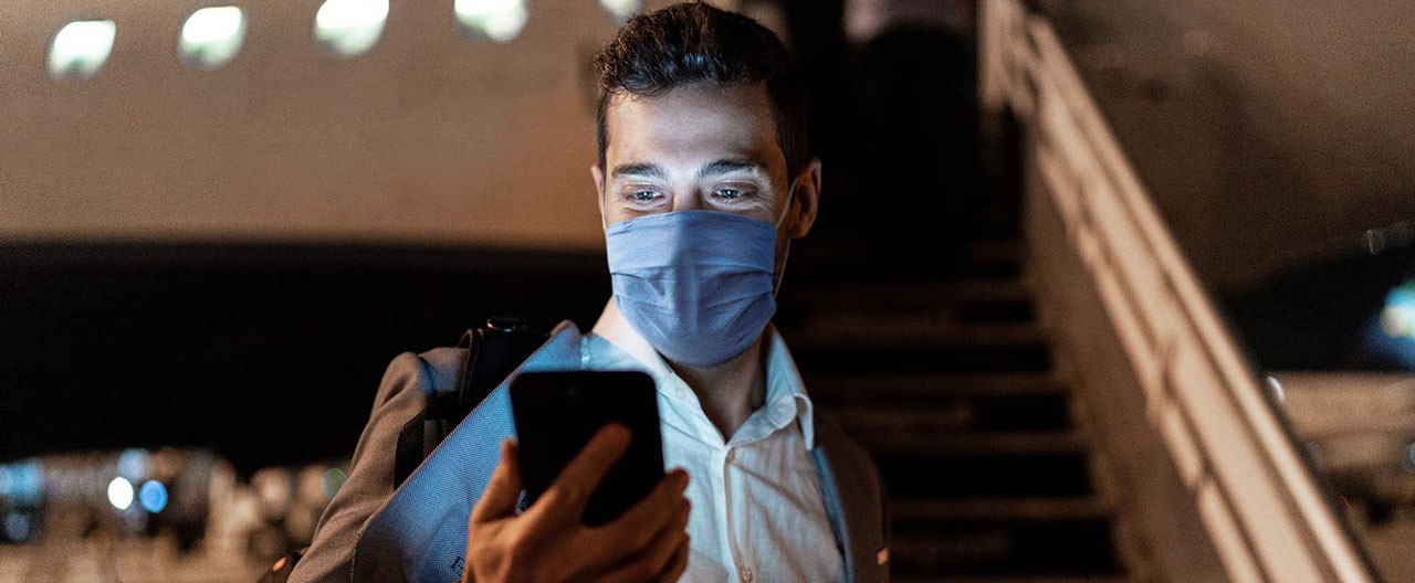 businessman in protective mask airport