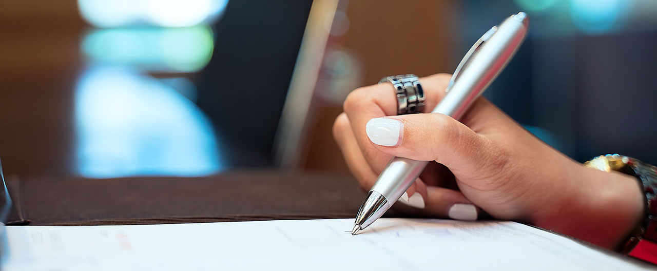 businesswoman signing contract