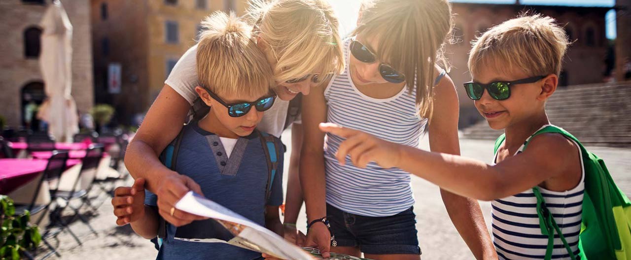 family checking a travel map during a trip