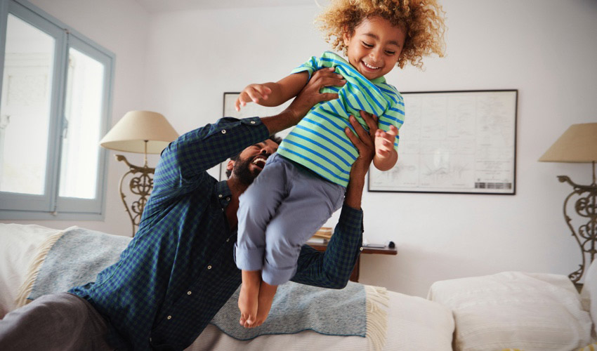 father playing with child