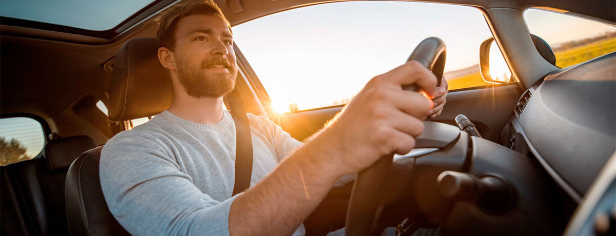 man driving a car insured by Chubb car insurance