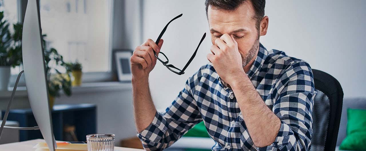 tired man at desk