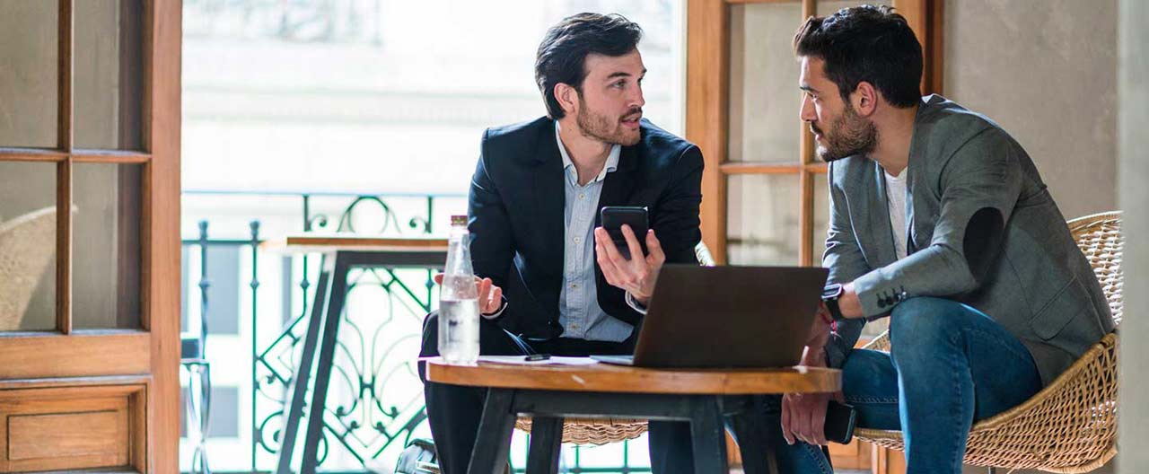 two men discussing business