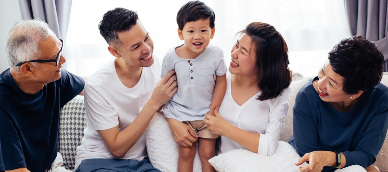 happy family sitting on the sofa