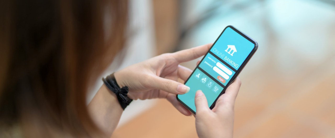 woman hand using black smartphone onlinebanking