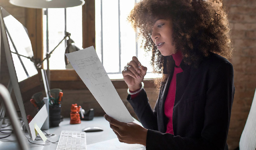 woman holding a paper