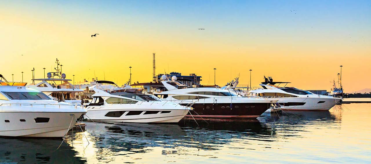 boats at marine and sunset behind