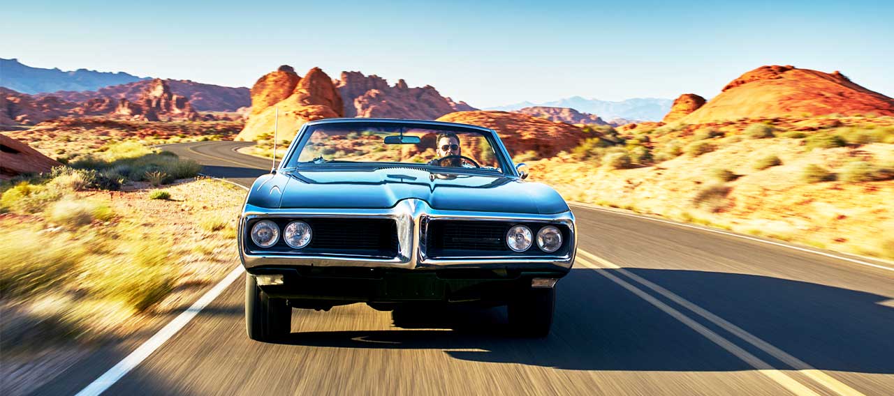 classic car on a scenic drive