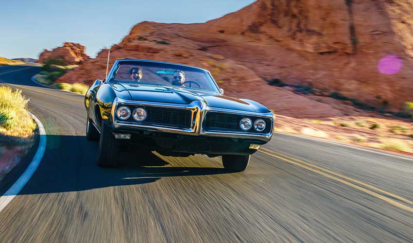 couple riding in classic car