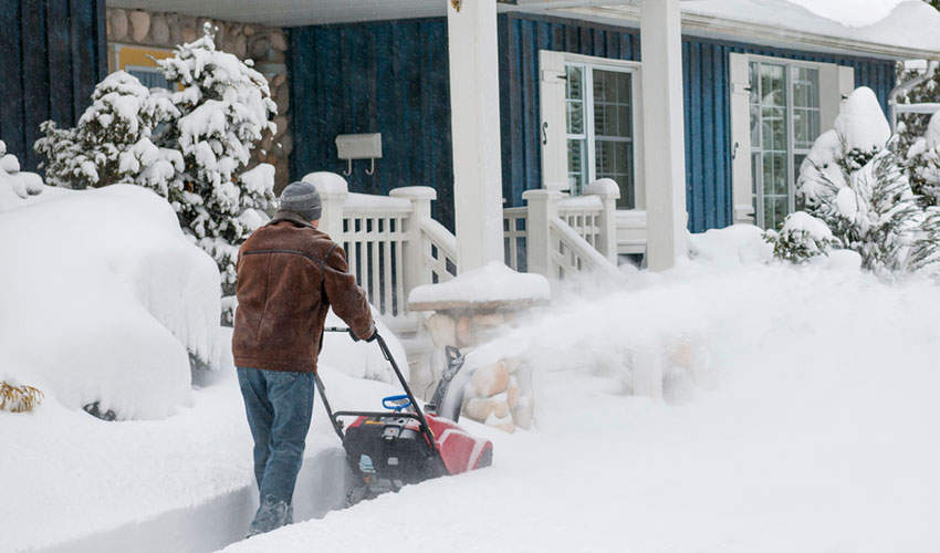 man clearing snow