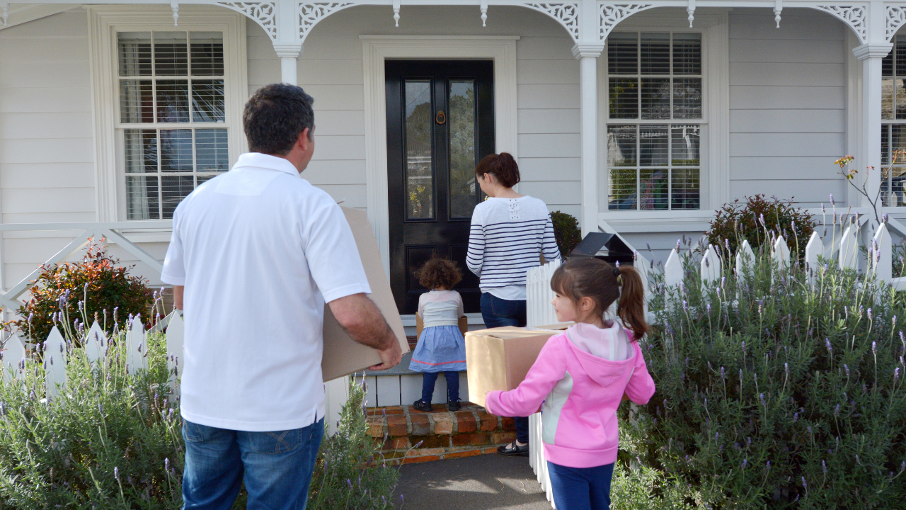 family entering house