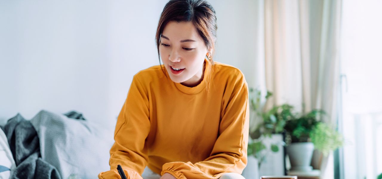 Young woman signing contract